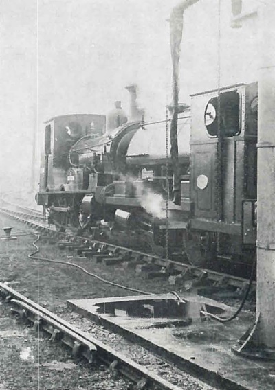 2-4-0 well tank No. 0314 & 0-4-0 saddle tank No. 2104 by the water tower in the down yard
