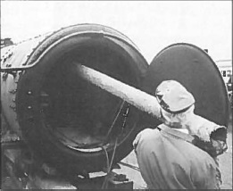 Brian Wheeler struggles with a large flue that is heavily encrusted with scale.