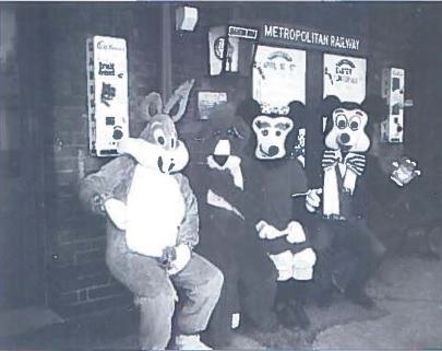 Easter cartoon Fun Day characters pose under the fruit and nut machine
